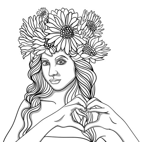 Woman making a heart - shape gesture with sunflower wreath