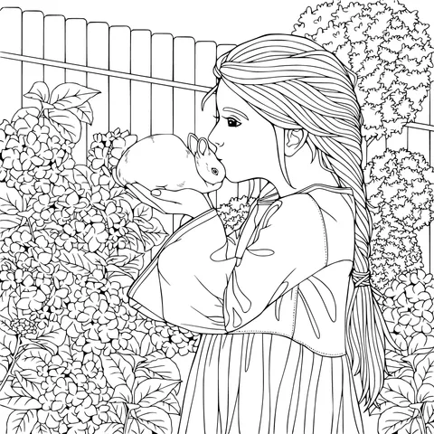 Girl kissing a rabbit in her arms