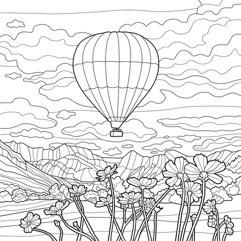 Hot air balloon flying over a flower - filled field and mountains